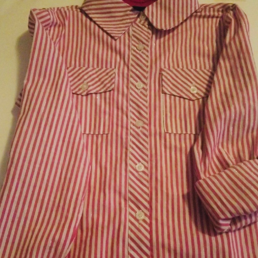 We are selling a girls shirt size 14.